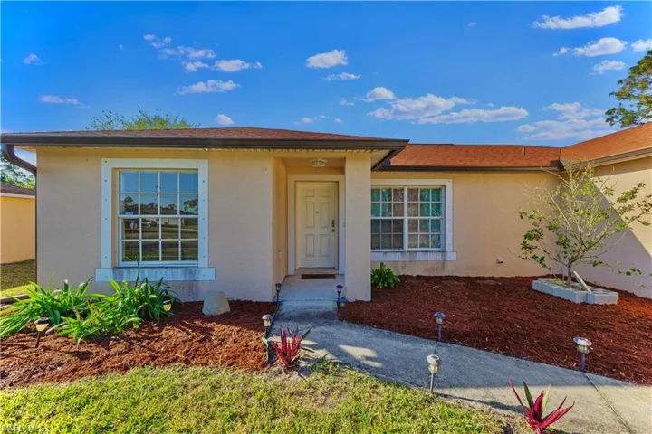 Ranch-style home featuring stucco siding