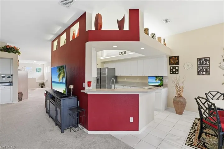 Kitchen opens to the living and dining spaces.