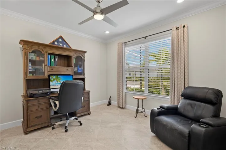 Office space with ornamental molding, baseboards, a ceiling fan, and recessed lighting