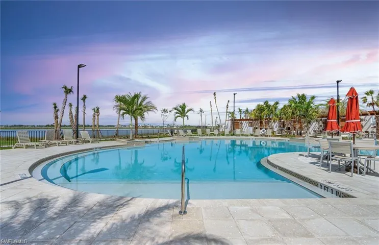Community pool featuring a patio