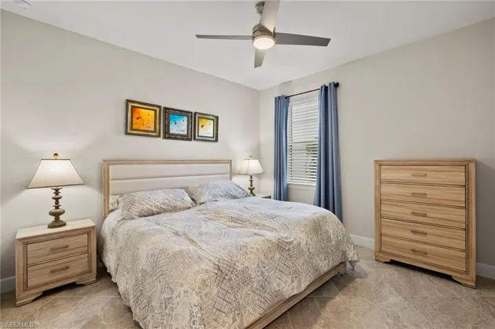 Bedroom featuring baseboards and a ceiling fan