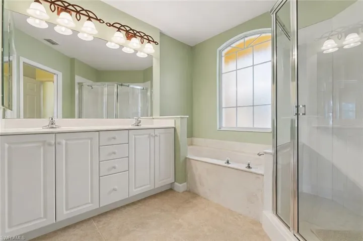 Master bathroom with soaking tub and shower.