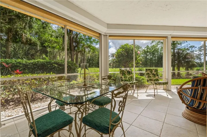 Expansive wrap-around lanai, protected with remote controlled electric storm shutters.