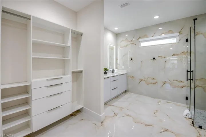 Integrated custom closet shelving system with drawers and hanging rods