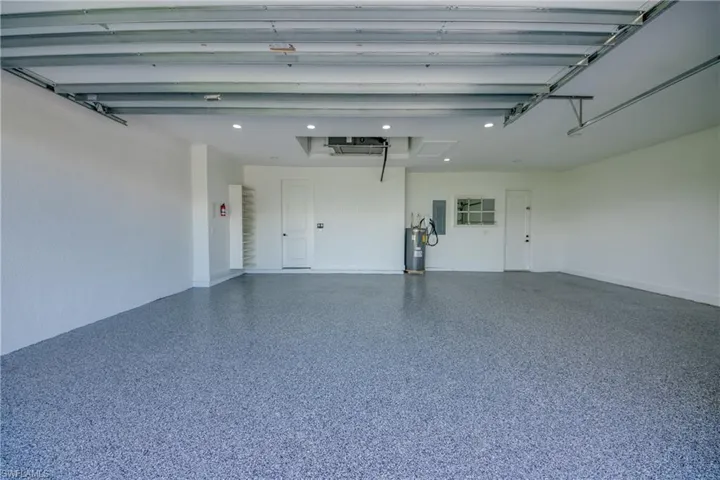 Garage featuring water heater