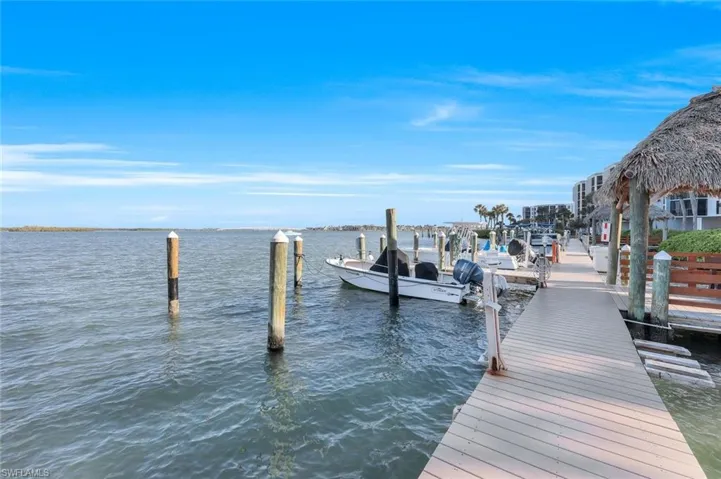 Dock area featuring a water view