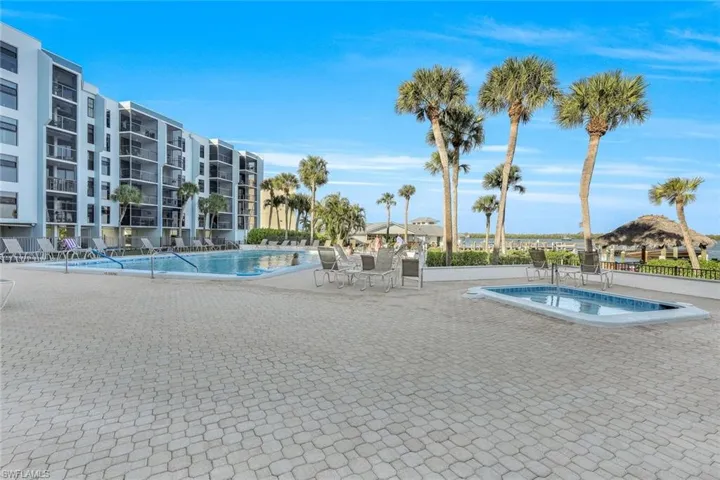 Pool featuring a hot tub and a patio