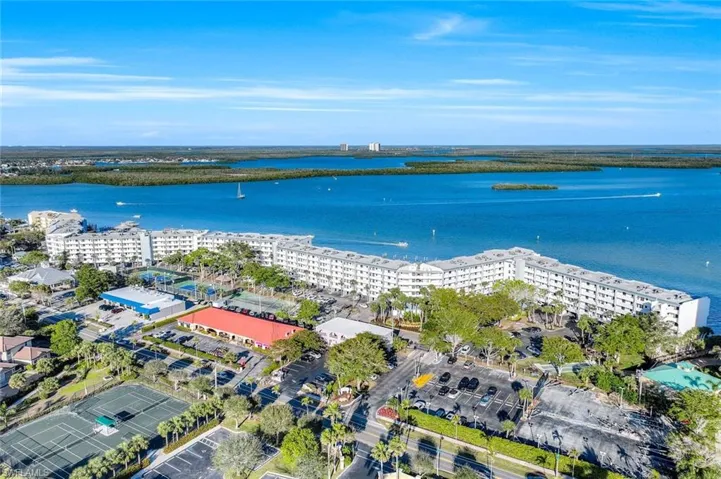 Drone / aerial view featuring a water view and a view of city