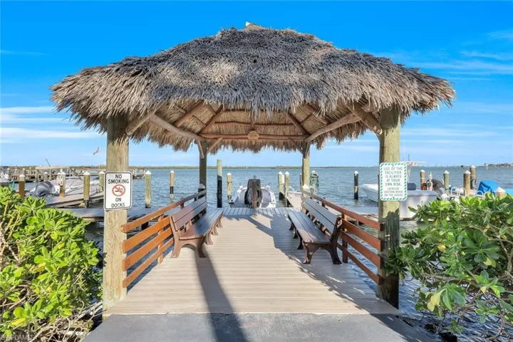 View of dock featuring a water view and a gazebo