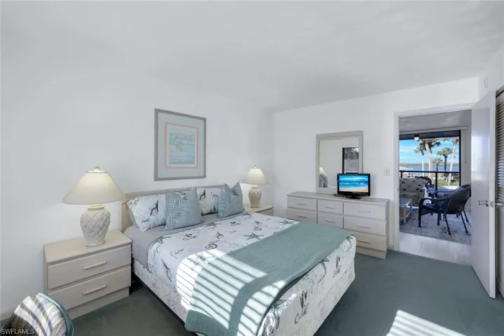 Bedroom with dark carpet