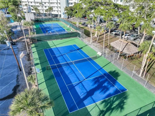 View of sport court featuring fence