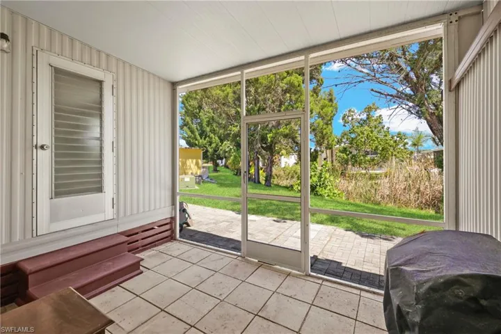 Sunroom featuring entry steps