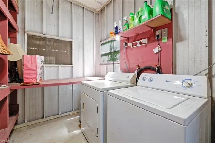 Washroom featuring washer and dryer