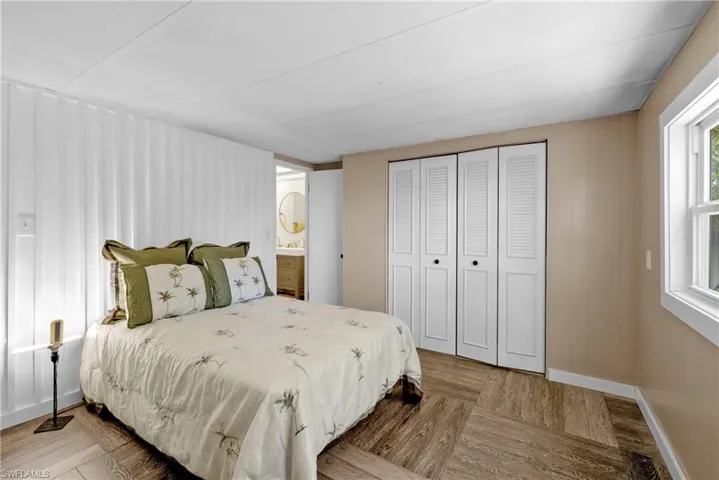 Bedroom featuring a closet and baseboards