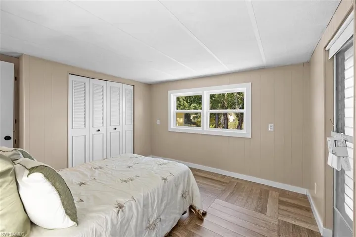 Bedroom featuring baseboards and a closet
