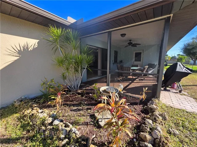 View of patio / terrace with ceiling fan and grilling area