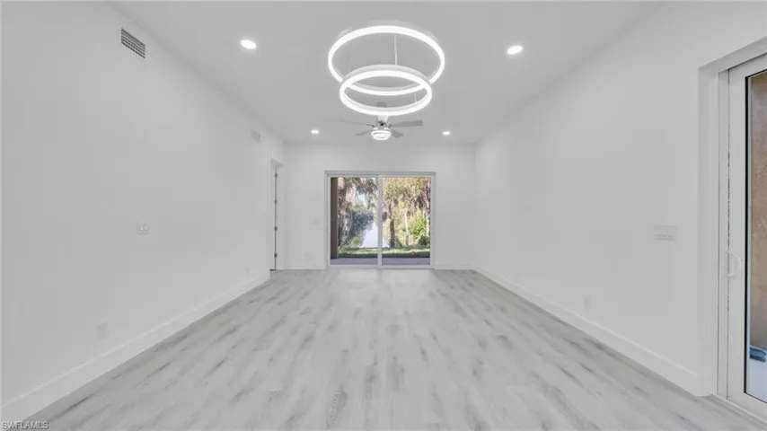Empty room with recessed lighting, light wood-type flooring, and a ceiling fan