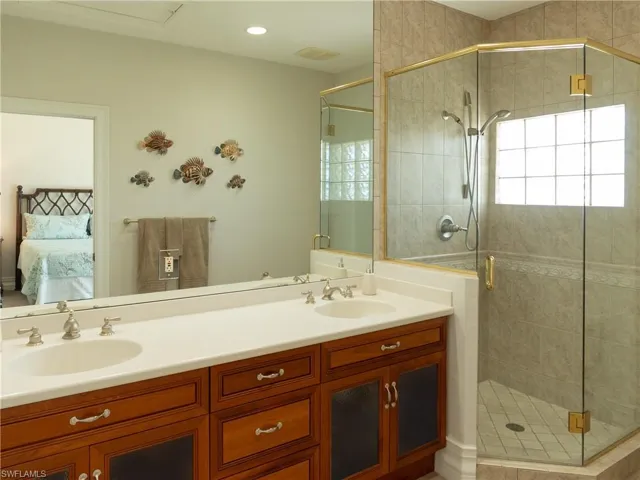 Bathroom with an enclosed shower and vanity