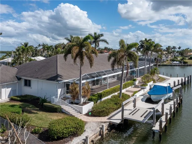 Dock area with a water view and a lanai