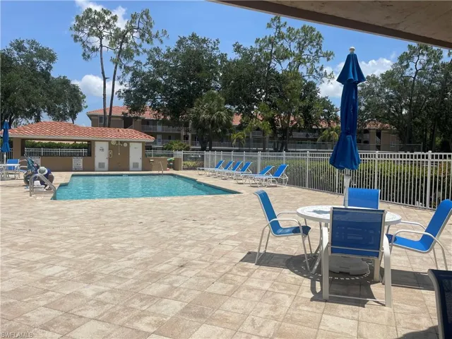 Community pool featuring a patio
