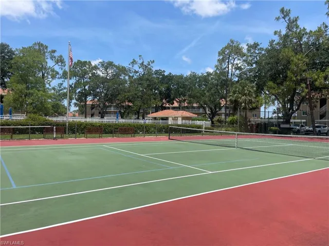 View of tennis court with community basketball court