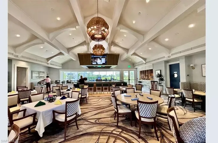 Dining area featuring high vaulted ceiling, beamed ceiling, and recessed lighting