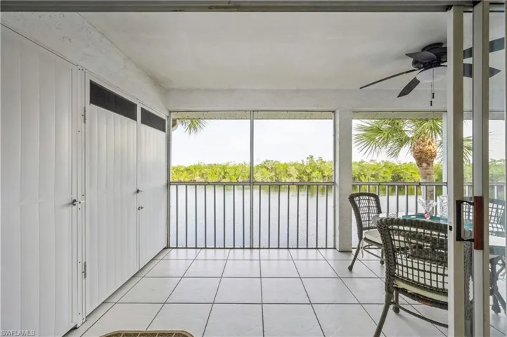 Sunroom with a water view