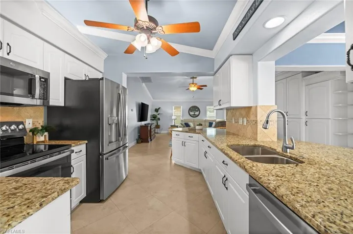 All stainless appliances and white shaker cabinets