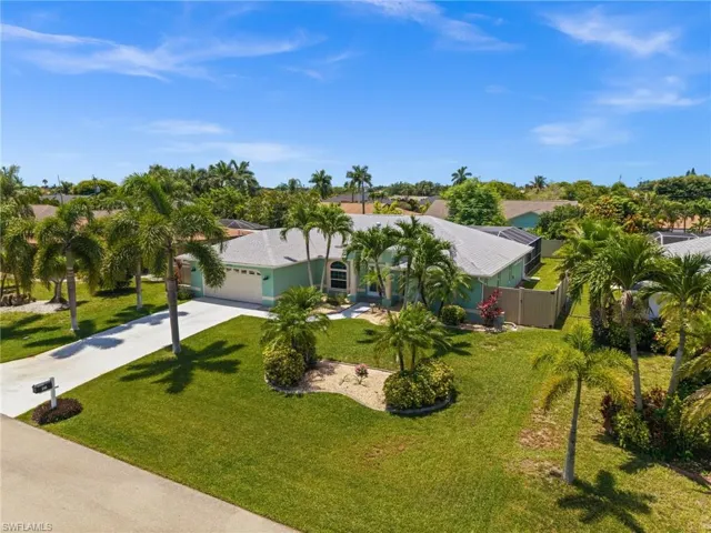 Mature landscaping throughout the large yard