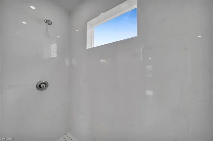 Full bathroom featuring a marble finish shower