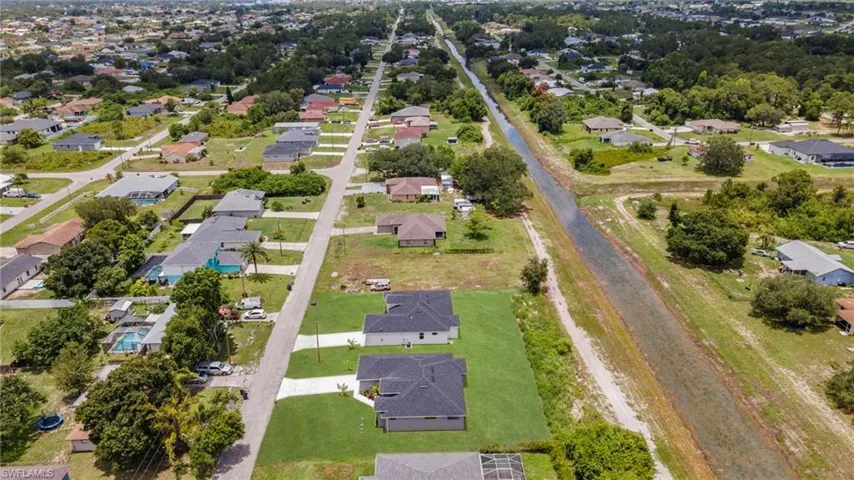 Aerial overview of property's location featuring nearby suburban area