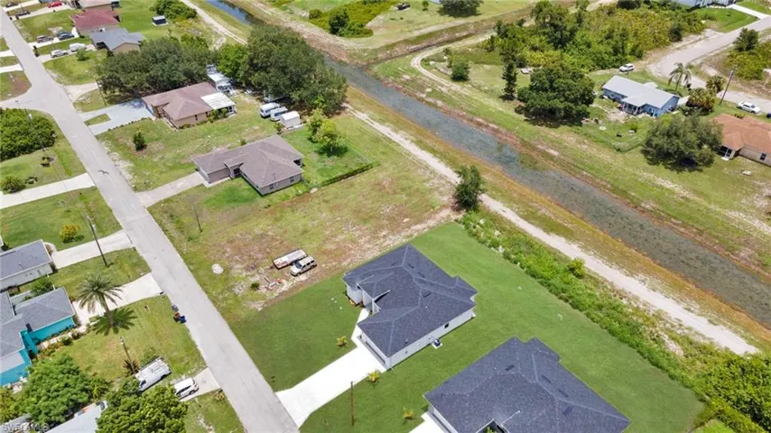 Aerial overview of property's location with nearby suburban area