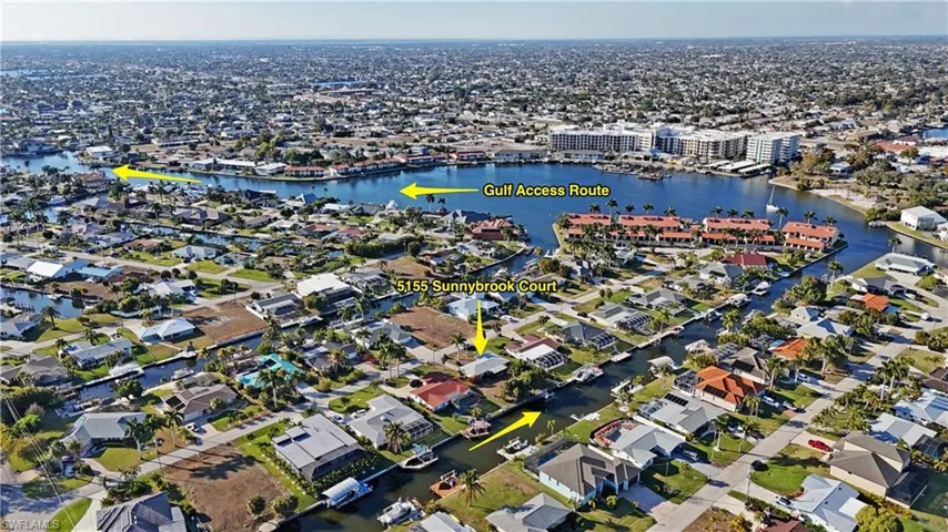 Aerial overview of property's location with a large body of water