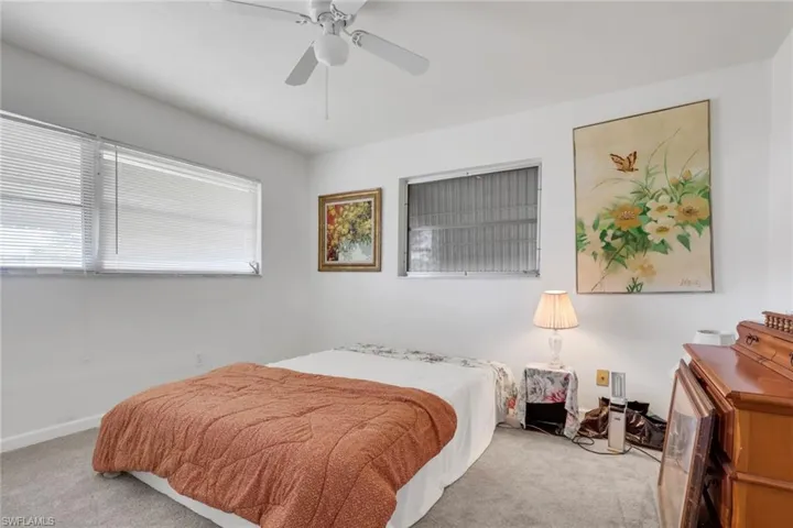 Bedroom with carpet and ceiling fan
