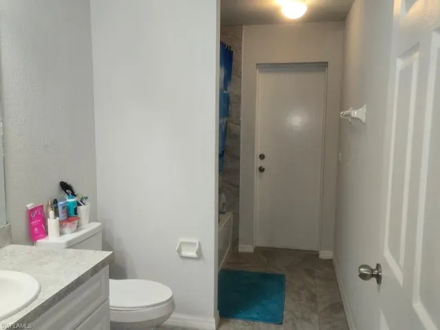 Full bathroom with vanity and shower / tub combo with curtain