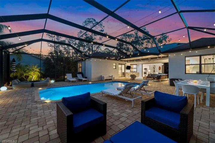 Outdoor pool with outdoor lounge area, outdoor dining space, a patio, and a lanai