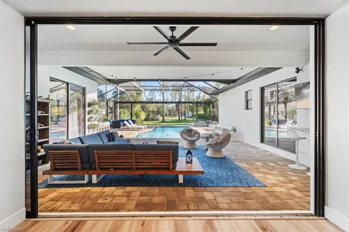 Triple slider open from living room to lanai.