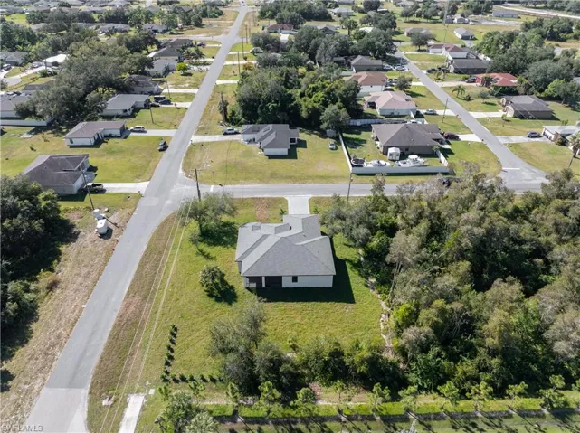 Aerial overview of property's location with nearby suburban area