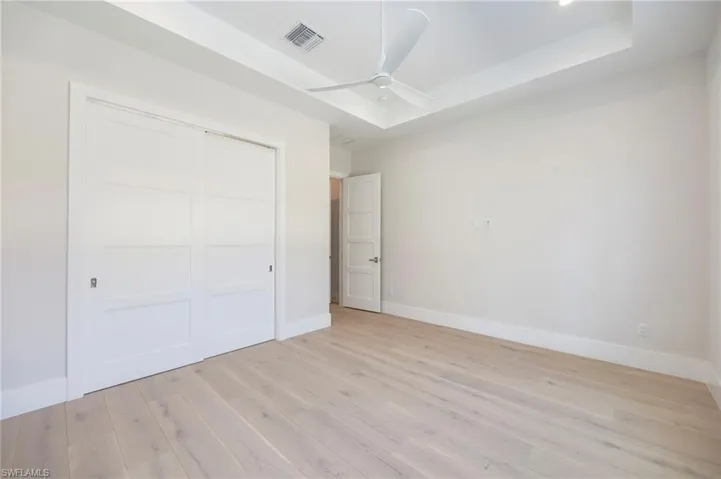 Bedroom 4 is situated in the front of the home with a large window, making it a perfect flex room as an office, den, or guest space.