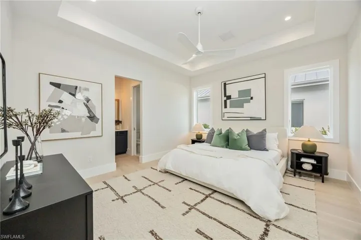 Bedroom 2. 4542 Seagrove is listed as unfurnished. This home has been staged with furniture and accessories, all of which is available for purchase. Unfurnished  photos are included in the listing photo album.