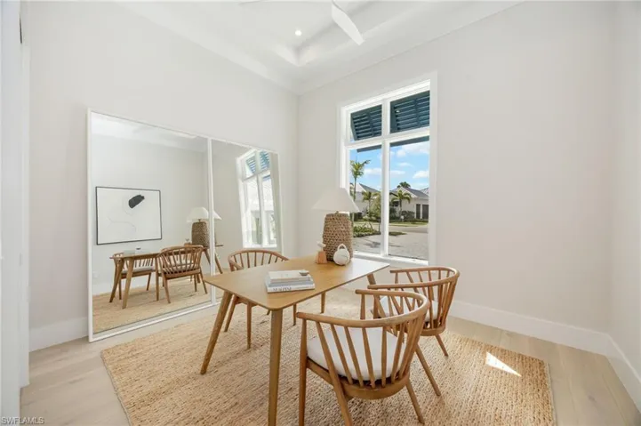 Bedroom 4 (staged as an office). 4542 Seagrove is listed as unfurnished. This home has been staged with furniture and accessories, all of which is available for purchase. Unfurnished  photos are included in the listing photo album.