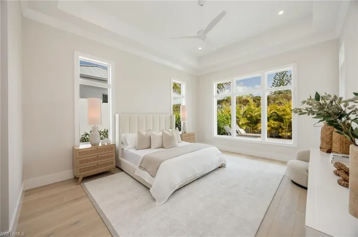 Primary bedroom. 4542 Seagrove is listed as unfurnished. This home has been staged with furniture and accessories, all of which is available for purchase. Unfurnished  photos are included in the listing photo album.