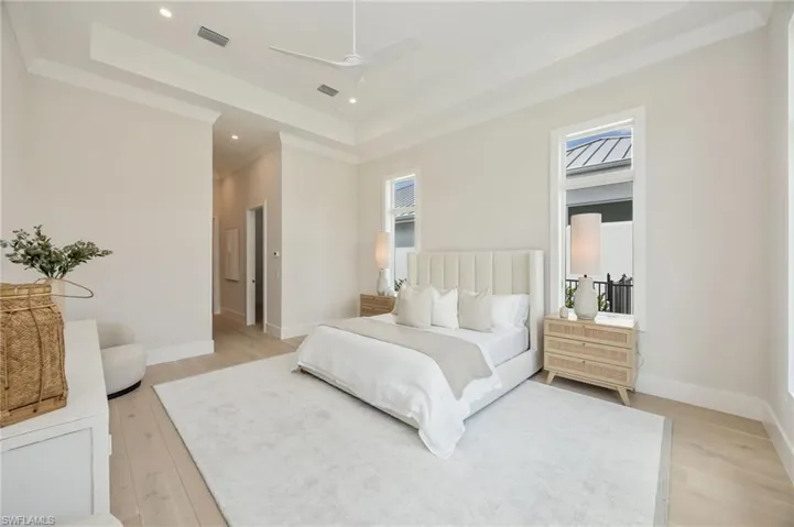 Primary bedroom. 4542 Seagrove is listed as unfurnished. This home has been staged with furniture and accessories, all of which is available for purchase. Unfurnished  photos are included in the listing photo album.