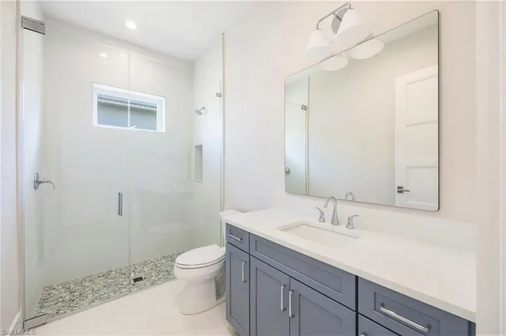 Bathroom 3 is adjacent to bedroom 3 and provides close access from the pool deck.