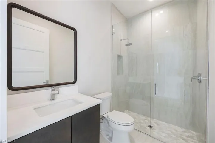 Bathroom 4 is adjacent to bedroom 4 -tucked just off of the great room.