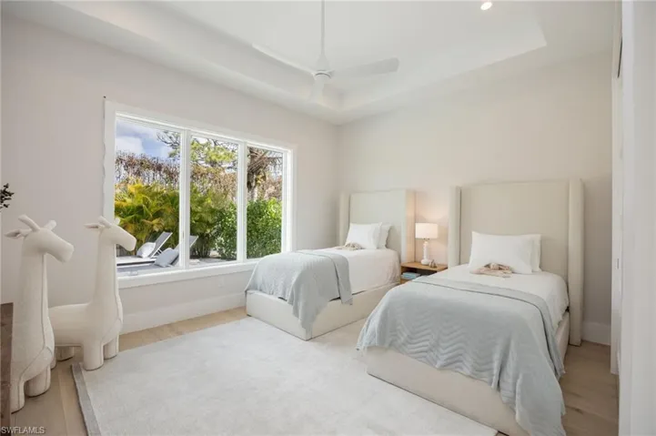 Bedroom 3. 4542 Seagrove is listed as unfurnished. This home has been staged with furniture and accessories, all of which is available for purchase. Unfurnished  photos are included in the listing photo album.