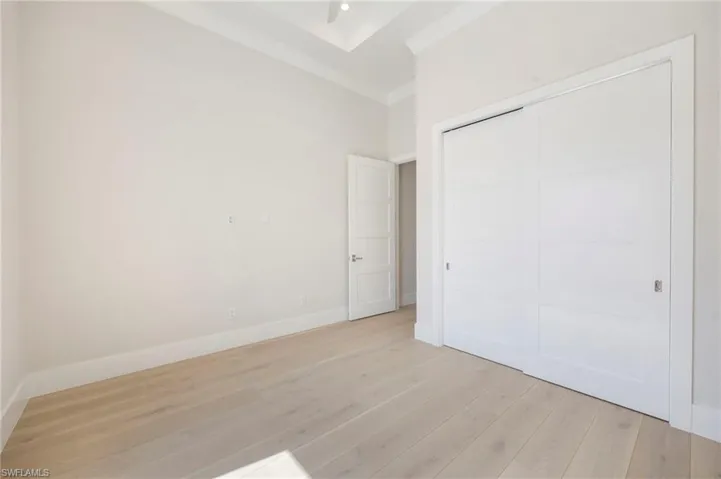 Bedroom 4 is situated in the front of the home with a large window, making it a perfect flex room as an office, den, or guest space.