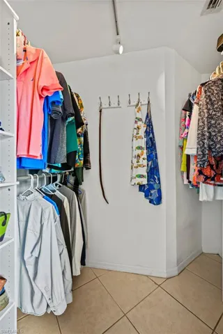 Spacious closet featuring tile patterned floors