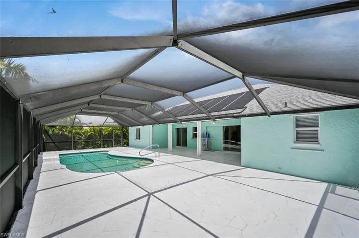 Outdoor pool featuring a patio area and a lanai