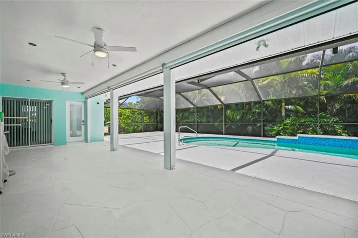 Swimming pool featuring a ceiling fan and a patio